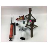 Spray paint gun, grease gun, jack stands, bottle