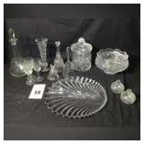 Variety of Glass Serving Items: Lidded Jar, Bells, Vase, Candle Holders, Plate, Decanter, Bowl, Wine Glasses, Etc.