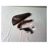 Smith & Wesson CTG 38 caliber Revolver and Dikar Spain 45 caliber Black Powder Pistol SR# 224707. With Brown Case.