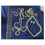 Lot of pearl like necklaces and projects