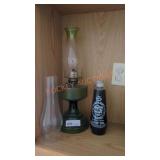 green vintage oil lamp with extra lamp oil