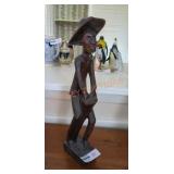 Hand carved wooden statue bongo player