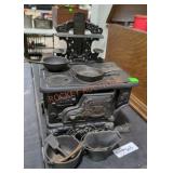 Vintage crescent cast iron mini stove