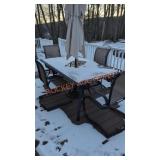 Patio set includes umbrella, table and chairs