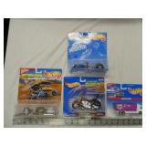 flat of 4 Hot Wheels toy vehicles