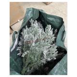 Snowy flocked Christmas tree with carry bag