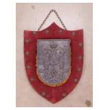 Cast metal coat of arms crest shield on velvet