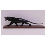 Vintage carved horn black panther on teak wood