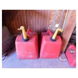 Two 5 gallon plastic gas cans