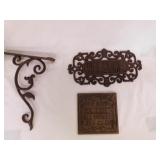 2 cast iron wall plaques, largest is 11.5" - Cast