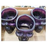 3 Purple glass skulls