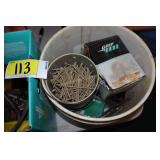 bucket of screws, banding tool, ear tagger, stabil