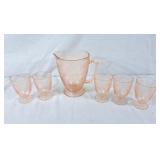 Pink Depression glass pitcher with 5 juice