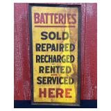 Batteries Here Embossed SST Sign