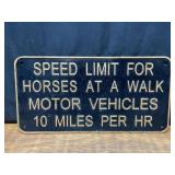 Horses at a Walk Speed Limit Sign