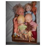 Group of vintage dolls, one wind up Roller Derby