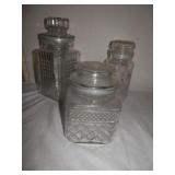 3-clear glass containers w/lids 7, 8, & 10" H