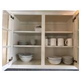 Assorted dishes in cabinet