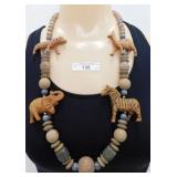 (136) VINTAGE 28" WOODEN NECKLACE WITH 4 CARVED AN