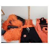 Cheerleader dresses and pompoms,