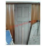 > vintage wood door with porcelain knob and