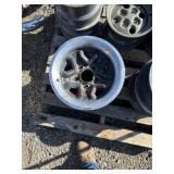 C1. Five lug 14 inch GM rims with beauty rings