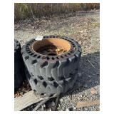 D1. (2) skid steer tires