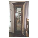 Cherry finish curio cabinet,  mirror back