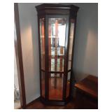 Corner curio cabinet with four glass shelves and inside light