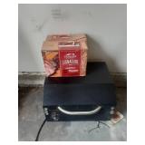 Traeger Wood Pellet Grill with 2 opened boxes(one is almost full) of hardwood pellets