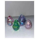 OBG and GES signed glass egg paperweights
