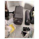 Electric pencil sharpener, stapler, tape dispensers and other office supplies.