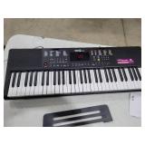 RockJam Compact 61 Key Keyboard with Sheet Music Stand, Power Supply, Piano Note Stickers & Simply Piano Lessons - Retail: $77.66
