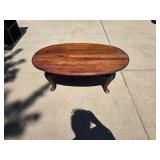 Wooden oval coffee table 46" W x 23" D x 18" H