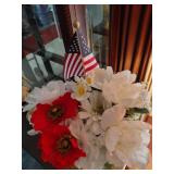 15 in tall plastic vase with white and red flowers and flag