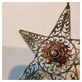 Vintage fillagre brass wire star with red stones 4" wide