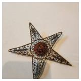 Vintage fillagre brass wire star with red stones 4" wide