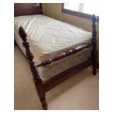 Twin size bed with post headboard and footboard (located upstairs)