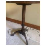 Side table with built in lamp. Approximately 60 inches tall and table is 15 inches diameter