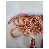 Beaded garland and decor in peach and dusty rose.