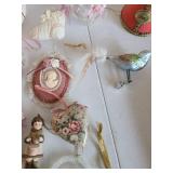 Assorted ornaments and decor in peach and ivory