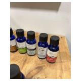 Little Crate Full of Essential Oil - Most of Them Are Half Full with a Few Completely Full