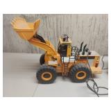 Caterpillar remote dump truck and loader