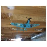 airplane models hanging in basement