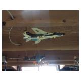 airplane models hanging in basement