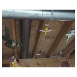 airplane models hanging in basement