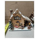 Lot of 3 Christmas Village items, hardware store, fishing store, and chapel, plays music just needs batteries