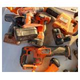 pile of untested power tools and batteries