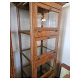 72x23x19 Oak glass front and side display cabinet. Has dropped front doors