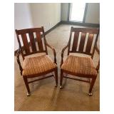 2 rolling office chairs